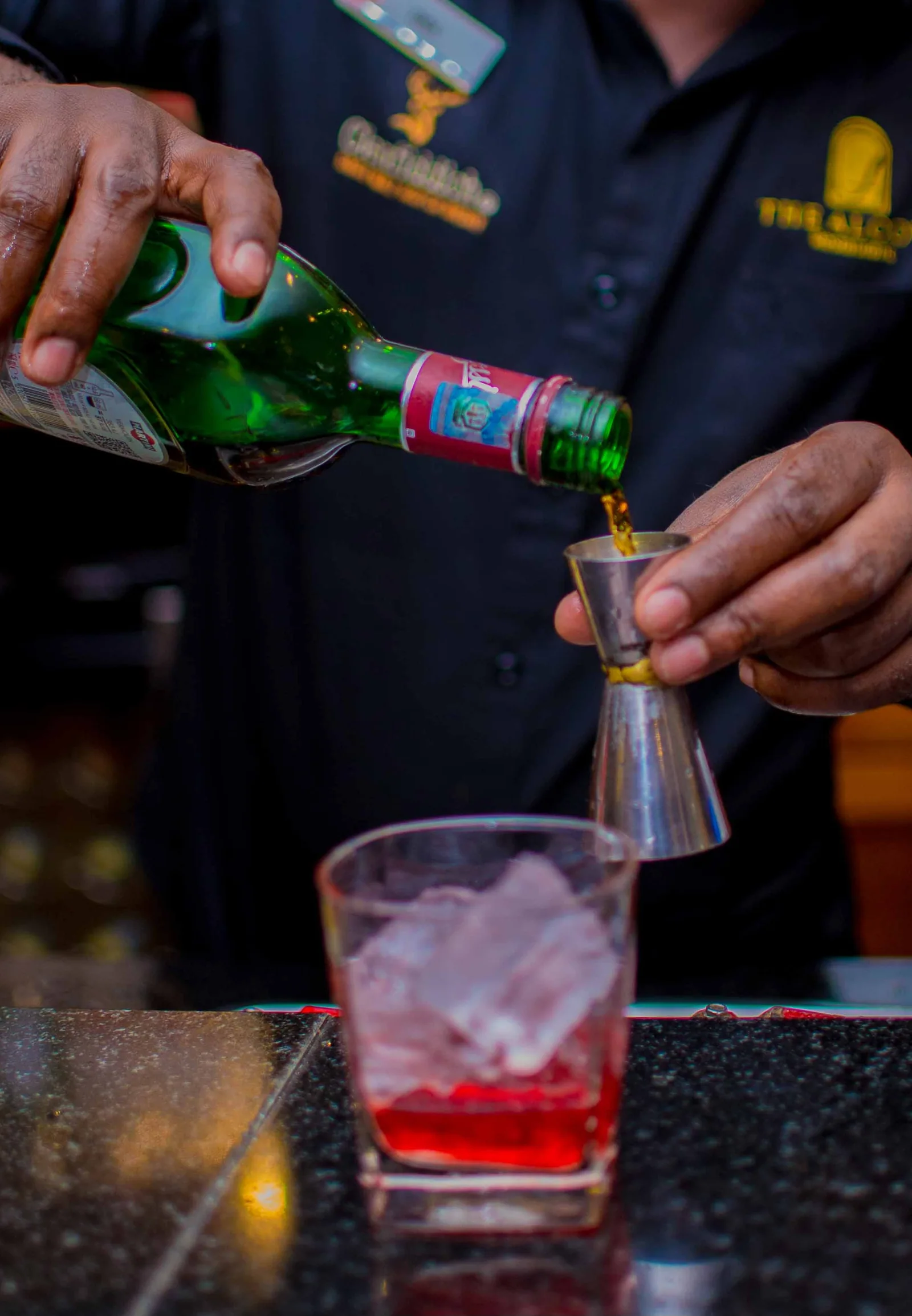 A cocktail being poured at the Alcove bar