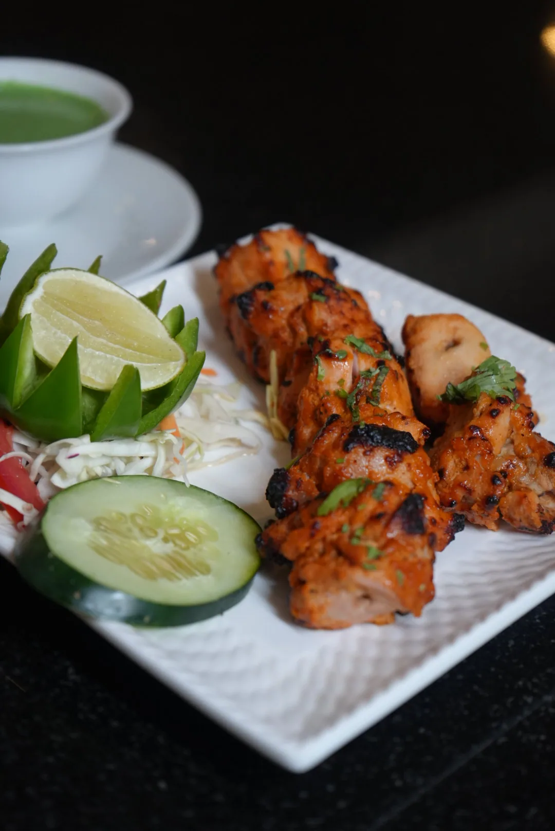 Malai tikka skewers with mint and cucumber